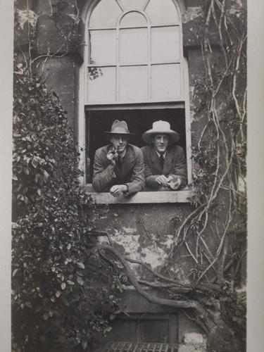 Men looking out of window